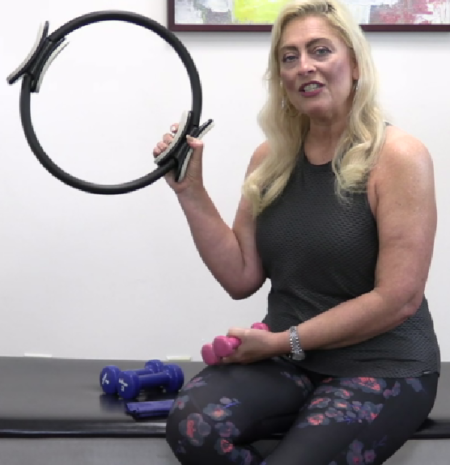 Sabrina Vaz holding a Pilates Magic Circle